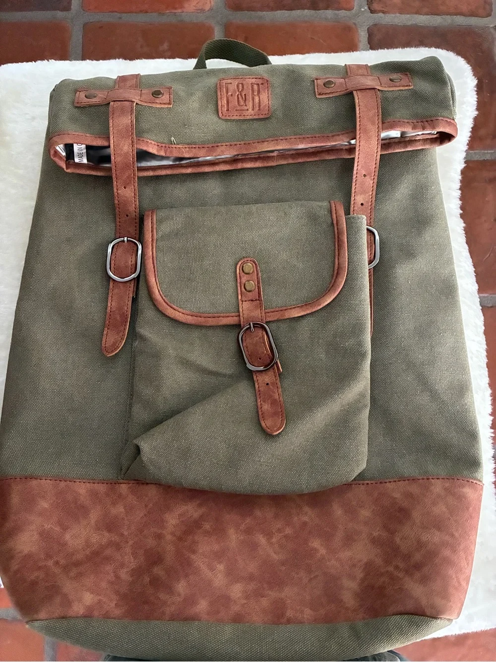 FOSTER & RYE insulated cooler wine backpack in olive green and brown.